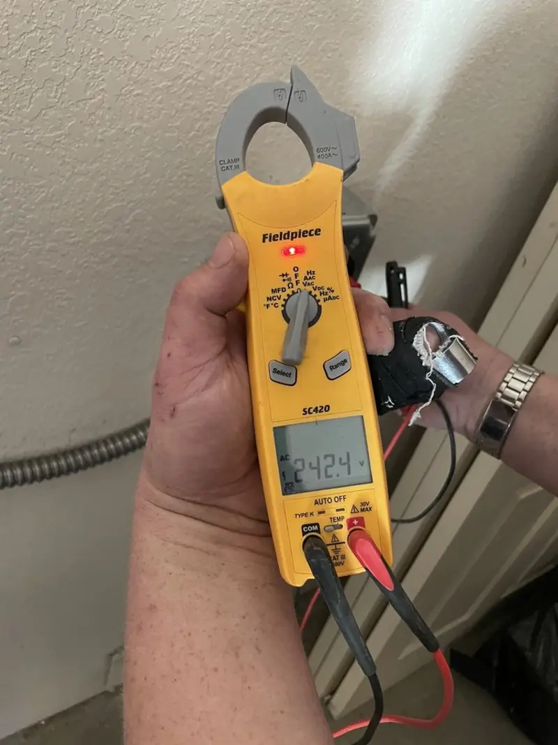 Voltage testing with clamp meter during Electrical Installation Services in Kingston